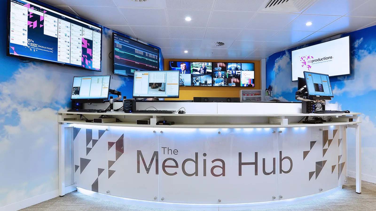Curved desk at ITN productions titled The Media Hub