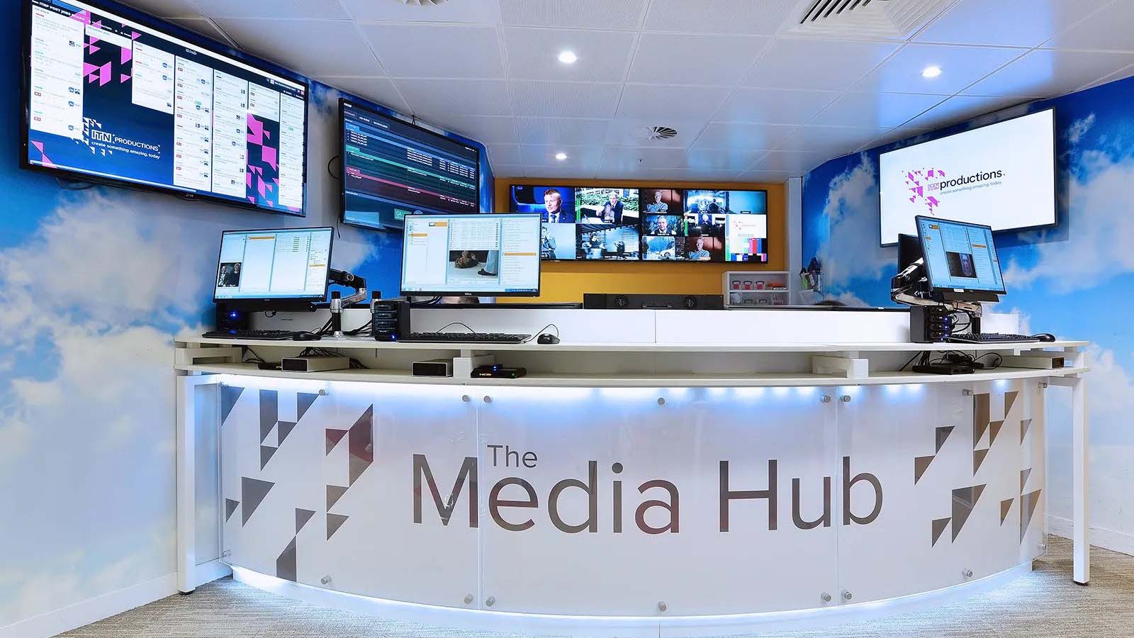 Curved desk at ITN productions titled The Media Hub