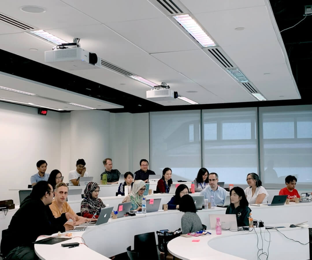 Students with laptops in a university setting