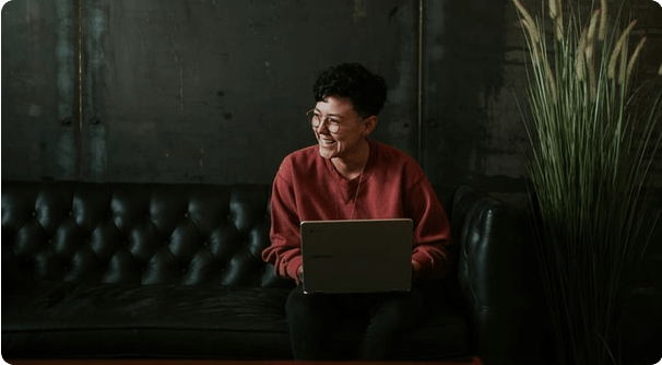 Remote worker with laptop on couch